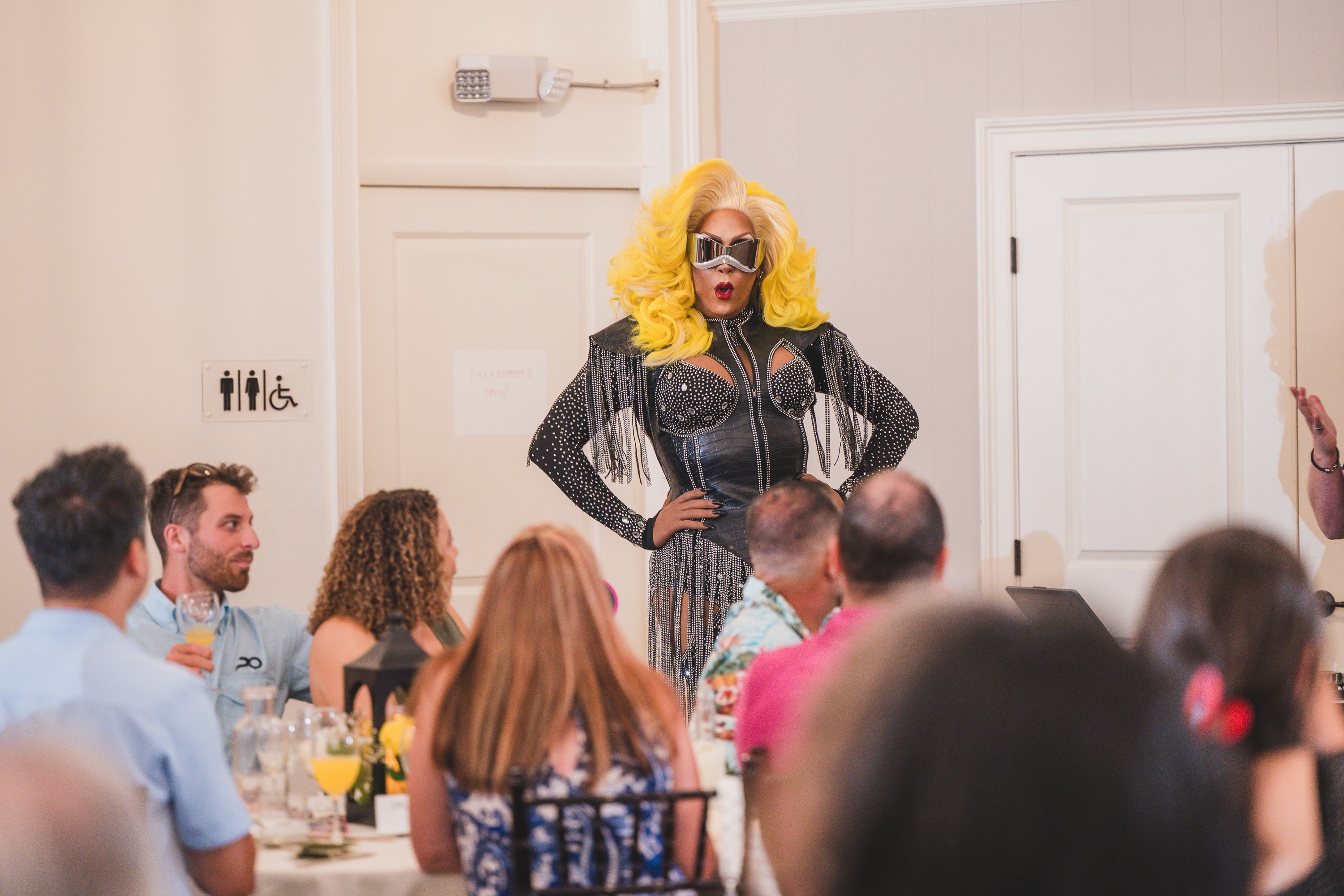 Drag performer entertaining the crowd at Peacocks & Divas 2025