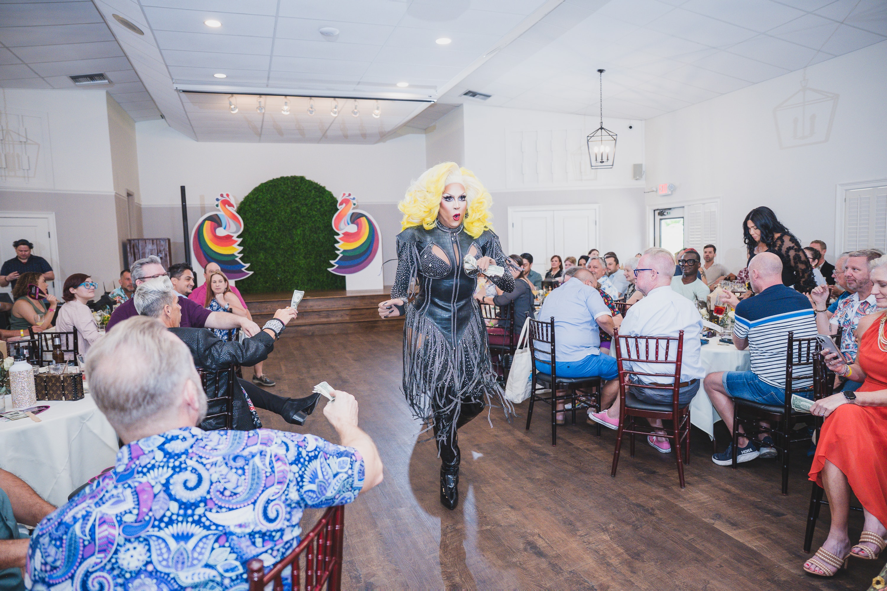 Drag queen performing at Peacocks & Divas 2025