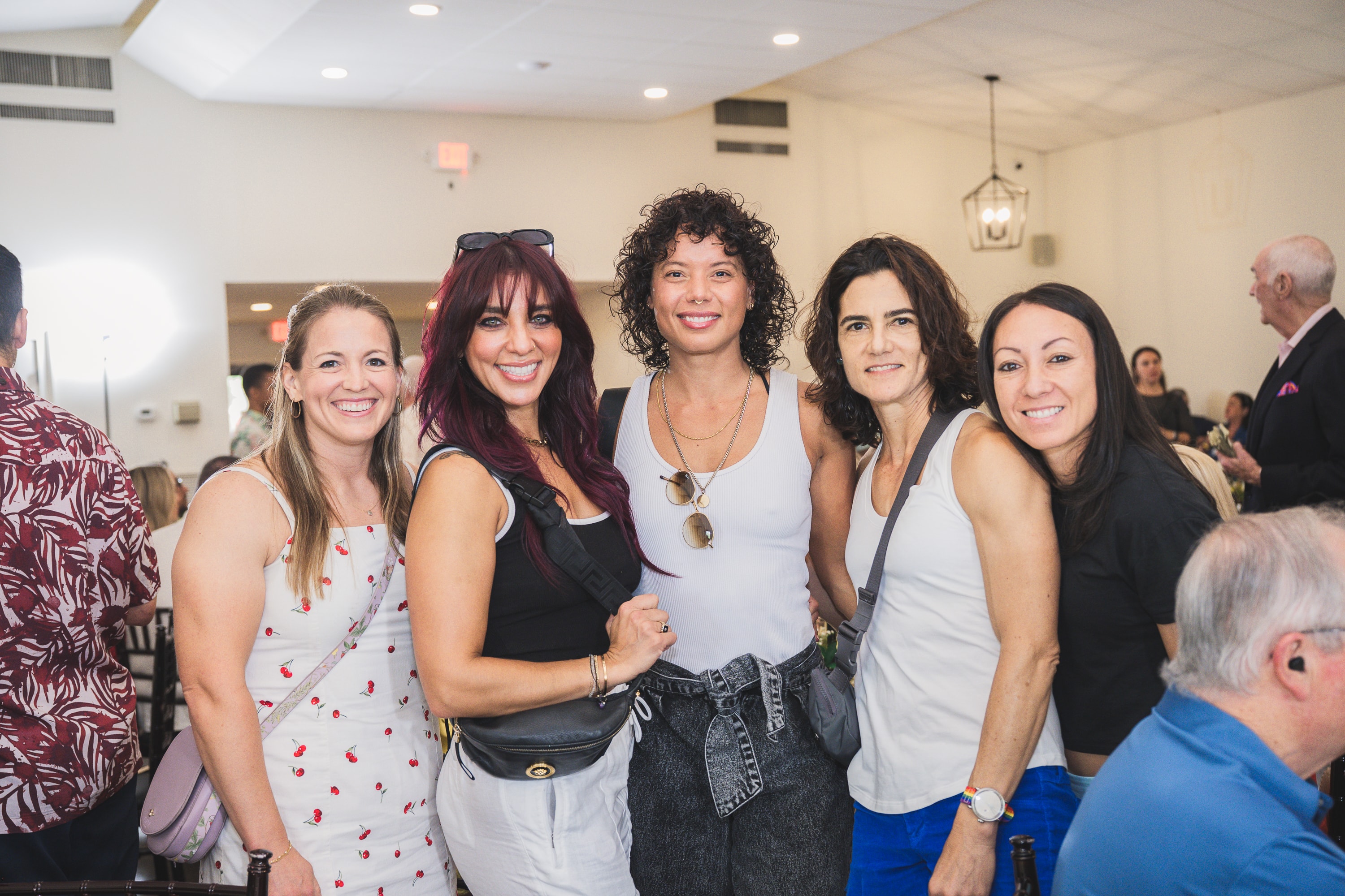 Five women posing at Peacocks & Divas 2025