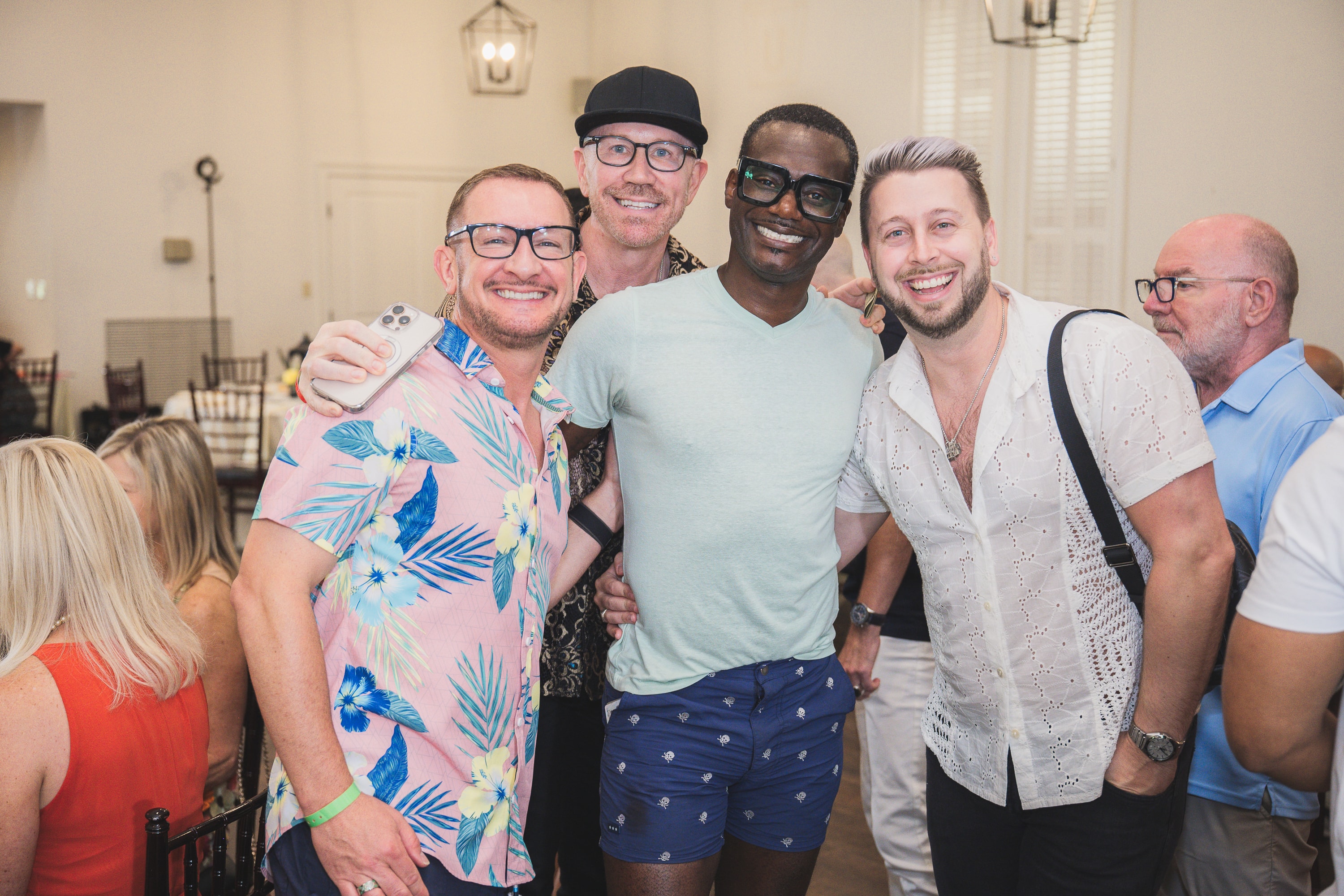 Four men posing at Peacocks & Divas 2025