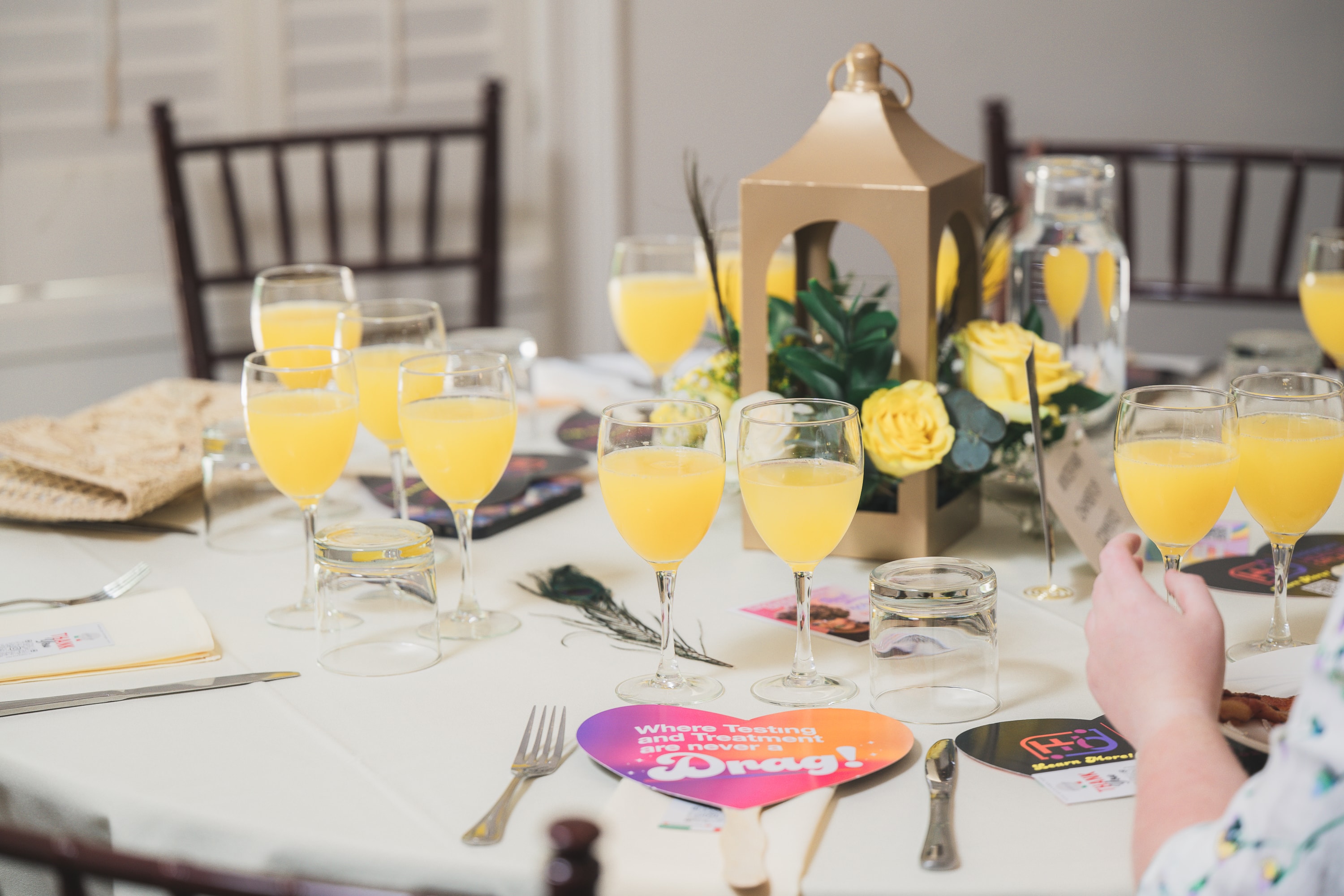 Mimosas and table settings at Peacocks & Divas 2025